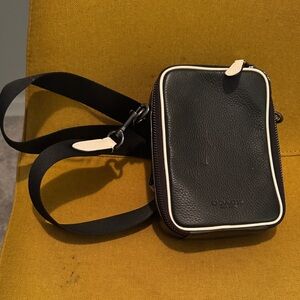 Coach Black Pebbled Leather Crossbody Phone Pouch with Cream Trim